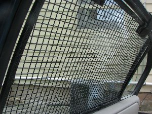 Inside view of the installed BreezeGuard car window screens.